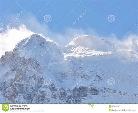 Snowy Mountain Peak Full With Snow Landscape In Clear Blue Sky Stock