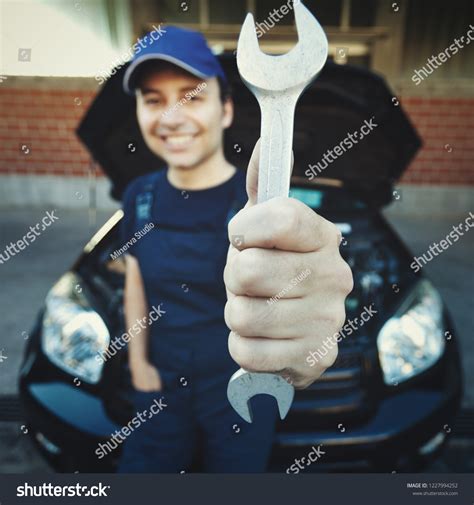 Smiling Mechanic Holding Wrench Car Garage Stock Photo 1227994252