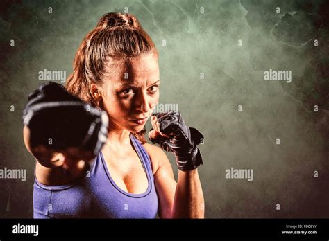 Composite Image Of Portrait Of Female Fighter Punching Stock Photo Alamy