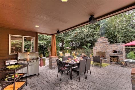 Outdoor kitchen and stone fireplace with pizza oven built into this deck. Outdoor Fireplace with pizza oven - Rustic - Patio ...