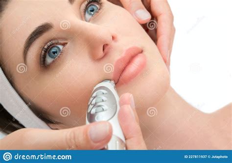 Rejuvenating Facial Treatment Isolated On White Model Getting Lifting Therapy Massage In A