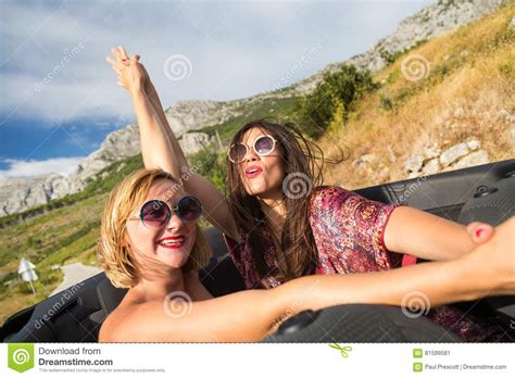 Two Girls At The Back Seat Of A Convertible Car Stock Image Image Of