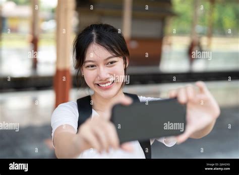 Beautiful Asian Girl Blogging Taking Photo By Smartphone Camera