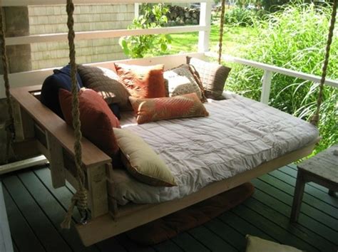 Laying down on a porch bed swing in the warm breeze, head propped on a pillow, a glass of sweet tea forming cold droplets of condensation on your hand. DIY Pallet Swing Plans: Chair, Bed & Bench | Wooden Pallet ...