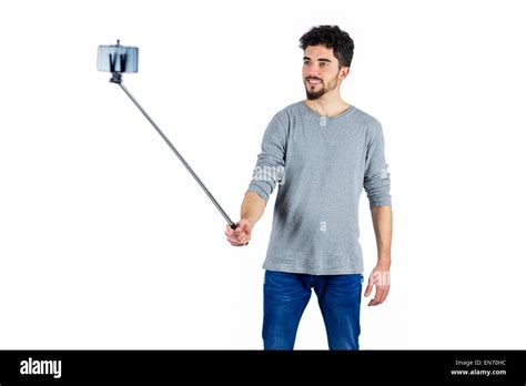 Casual Man Using A Selfie Stick Stock Photo Alamy