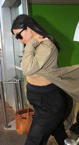 Starting To Show Kim Kardashian Displays Burgeoning Baby Bump In France