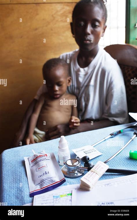 Child Suffering From Malnutrition Receiving Malaria Test Program Of