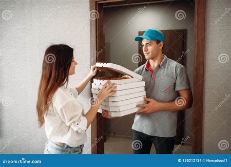 Delivery Man Shows Pizza To Customer At The Door Stock Photo Image Of