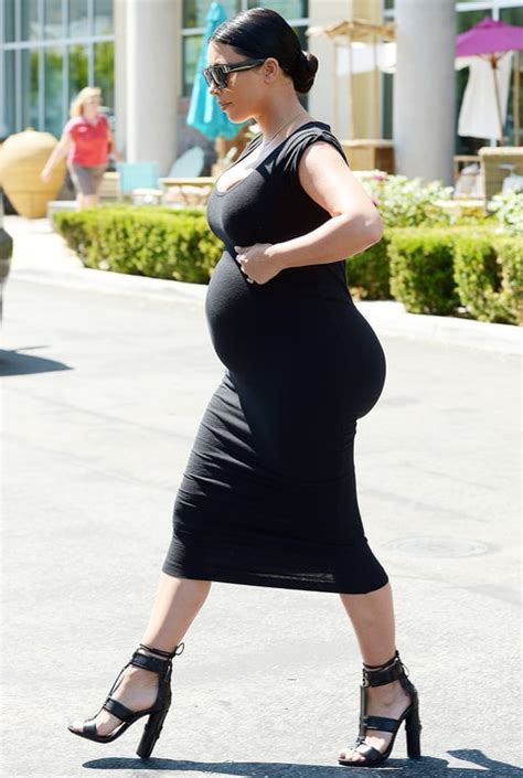 Pregnant Kim Kardashian Works Bold Curves In Tight Black Dress Us Weekly