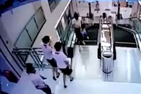 Mother Throws Son To Safety Before Falling To Death In Escalator Horror