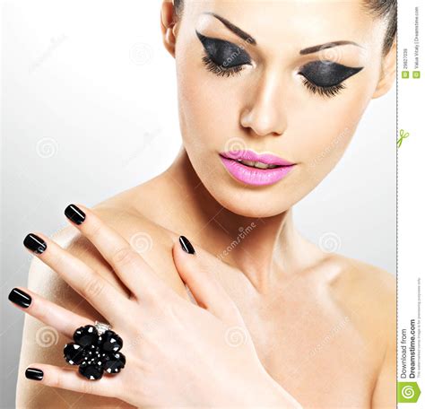 Face Of The Beautiful Woman With Black Nails And Pink Lips Royalty Free