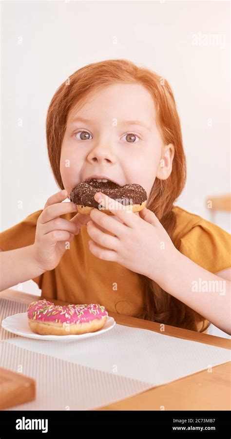 Little Girl Eating Round Doughnut Sweet Desert Unhealthy Food Stock