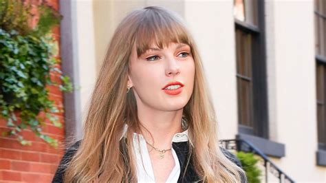 taylor swift wore an oversized shirt as a dress and it s giving new meaning to the pants free trend
