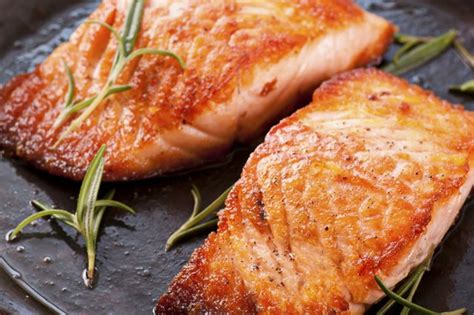 Raw meat and fish can be contaminated with bacteria which causes food poisoning. How To Safely Feed Your Dog Salmon | Cuteness