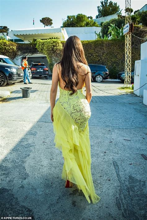 Demi Rose Shows Off Her Incredible Curves In Yellow Lace Dress With