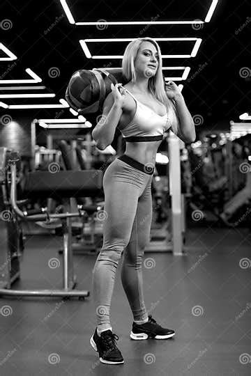 Fitness Blonde Woman Is Standing With Sand Bag In The Gym Bw Stock Image Image Of Shape