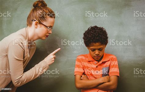 Teacher Shouting At Boy In Classroom Stock Photo Download Image Now