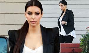 Kim Kardashian Throws Herself Back Into Work Tottering In Heels