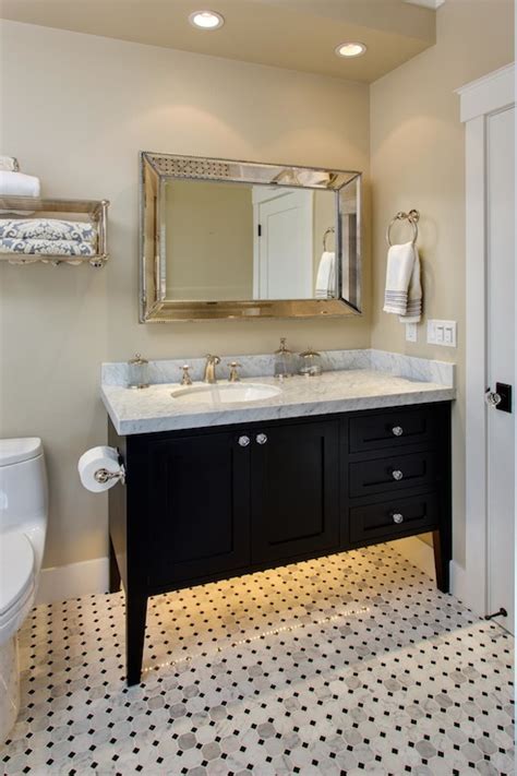 Black pulls and brass accents give modern polish to this bathroom's neutral palette. Black Bathroom Vanity - Transitional - bathroom - Latala Homes