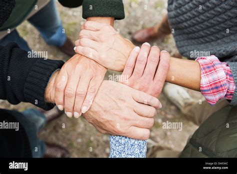 Four People Touching Hands High Angle Stock Photo Alamy
