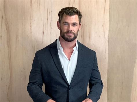chris hemsworth posted a photo of his enormous arms but people are just commenting on his