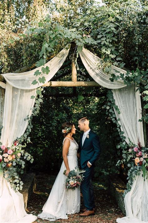 The wizards at a new leaf used the sketch to create nine floral garlands made of marigolds, bittersweet and dried oak leaves hanging from brown silk ribbon. 30 Best Floral Wedding Altars & Arches Decorating Ideas ...