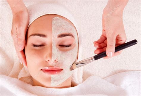 Woman Receiving Facial Mask At Beauty Salon — Stock Photo © Victoreus