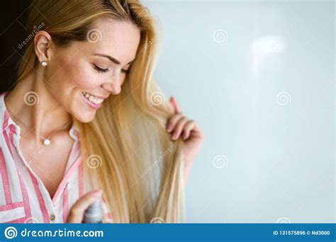 Woman Fixes Her Hair With A Hairspray Stock Photo Image Of Beautician Fashion