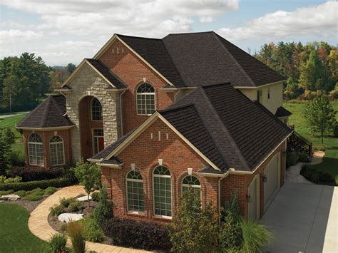 An Aerial View Of A Large Brick House With Lots Of Windows And
