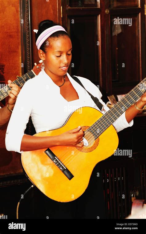 African Cuban Young Adult Musician Guitarist Woman Playing Performing