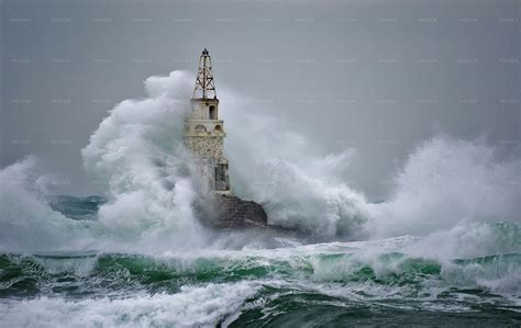 Waves Crash Against Lighthouse Stock Photos Motion Array