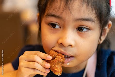 Asian Girl Eating Chicken Child Eating A Chicken Nuggets Stock Photo
