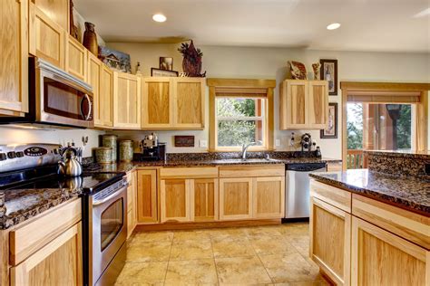 You might be surprised what a good scrubbing can do. How To Clean Wood Kitchen Cabinets - Housing Here