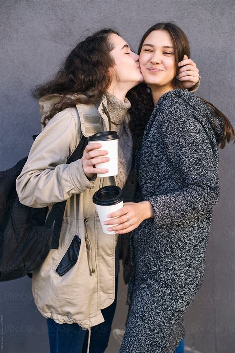 Two Young Girlfriends Hugging And Kissing Del Colaborador De Stocksy Danil Nevsky Stocksy