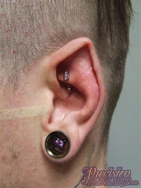 Tongue splitting, ear shaping and horn implants are just some of the wild body modifications you'll find in this top list. Fancy ear! New rook with Industrial Strength channel set ...