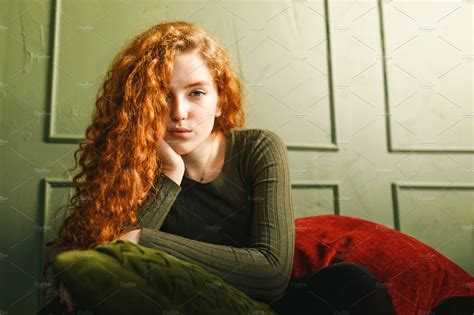 Redhead Girl Sitting At The Sofa Featuring Pillow Ginger And Hair