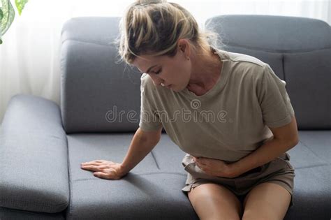 Sad Upset Unhappy Woman Holding Hands On Stomach Suffering From