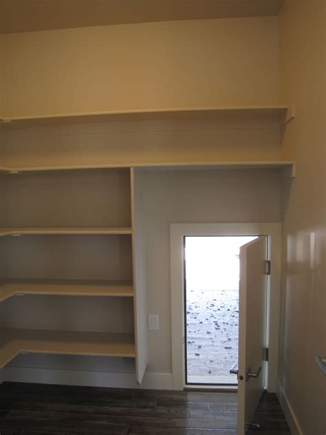 The idea is that she has a small door between the garage and the pantry. secret door from the pantry to the garage...no more ...