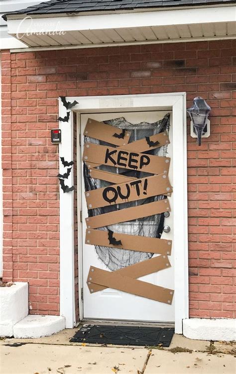 A Door That Has Been Decorated With Cardboard Taped To It And The Words