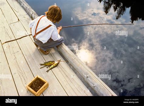 Young Boy Fishing Off Dock Kings Landing Historic Settlement