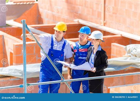 Team Discussing Construction Or Building Site Plans Stock Photo Image