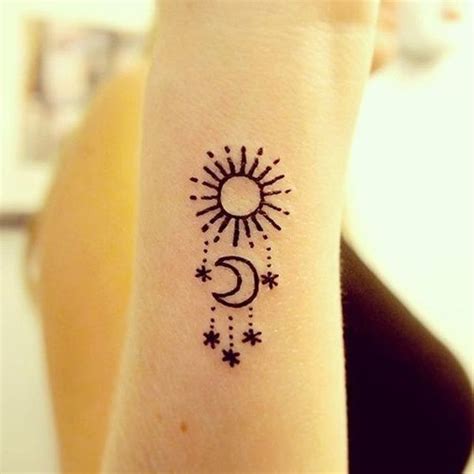 This inner arm tattoo reveals the whole lunar cycle that means the cyclic life and ever changing nature of everything. sun moon and stars henna tattoo | EntertainmentMesh