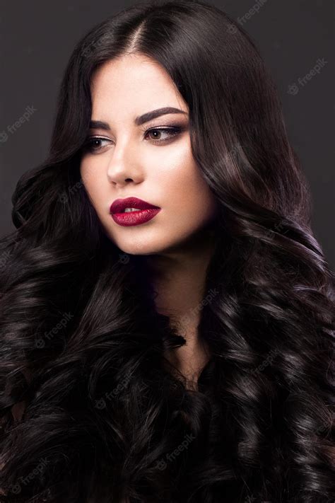 Premium Photo Beautiful Brunette Model Curls Classic Makeup And Red