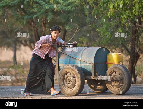 Burmese Women Transporting Water Near Mount Popa Burma Stock Photo Alamy
