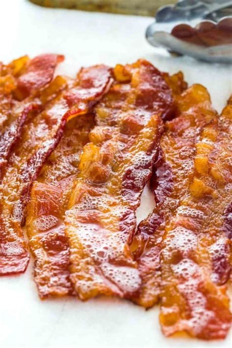 15 to 18 minutes at 425 degrees for slightly chewy and baking bacon in the oven has never been more easy or delicious. How to Cook Bacon in the Oven - Jessica Gavin