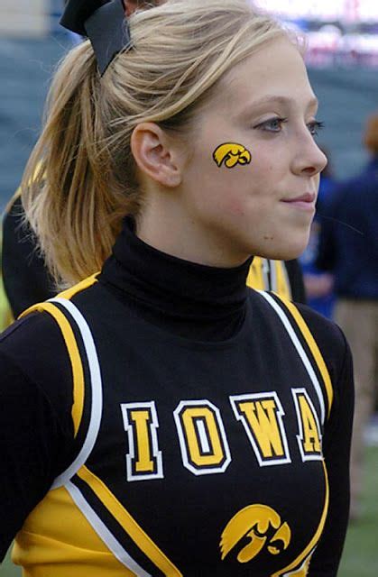 An Iowa Hawkeye Cheerleader Looking On Iowa Hawkeyes Cheerleaders