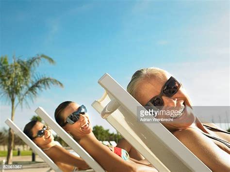 mature woman sunbathing photos and premium high res pictures getty images