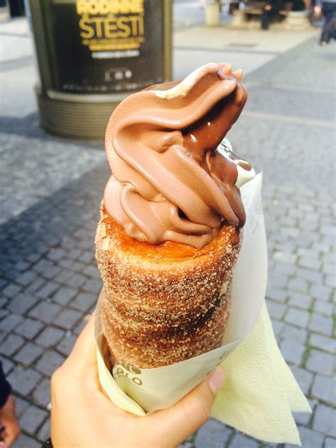 Trdelník Rolled Donut Delight Topped With Sugar Walnuts And Ice Cream