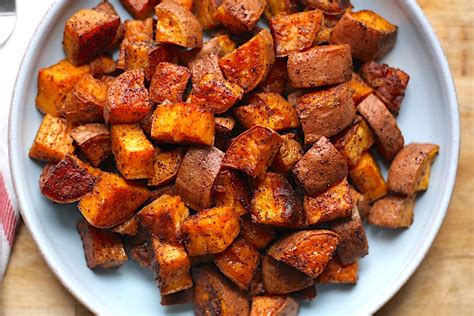 Toss sweet potatoes with olive oil, chili powder, salt, sugar and red pepper flakes. Chili-Roasted Sweet Potatoes | The Hungry Hutch