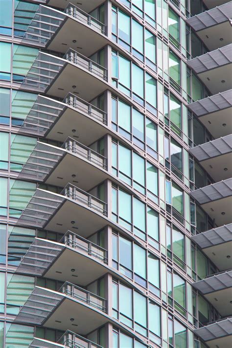 Download Wallpaper 800x1200 Building Balconies Facade Glass
